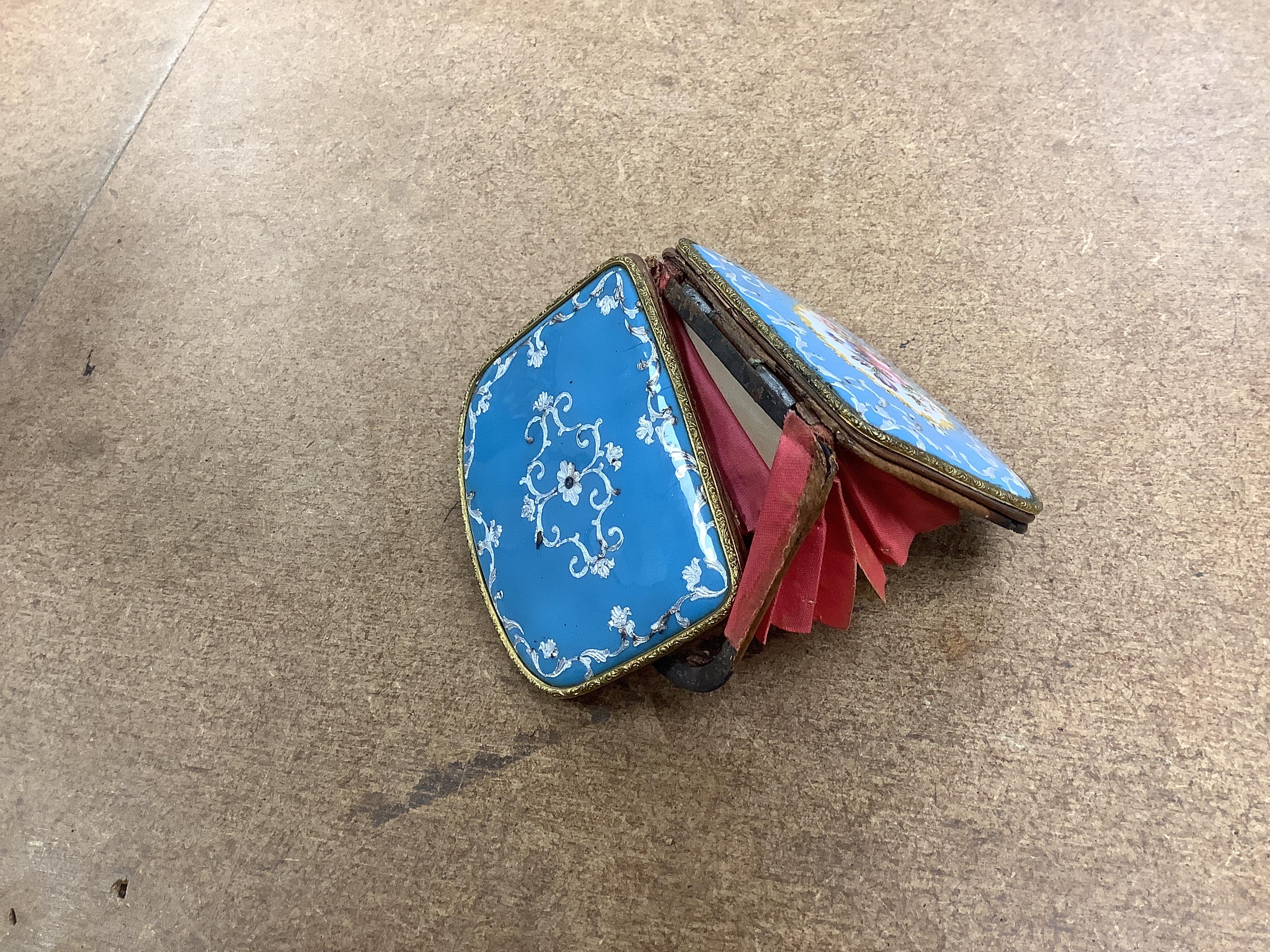 Two 19th century French or Swiss enamelled purses, One finely painted with a spaniel seated on a cushion, the other with a bouquet of flowers